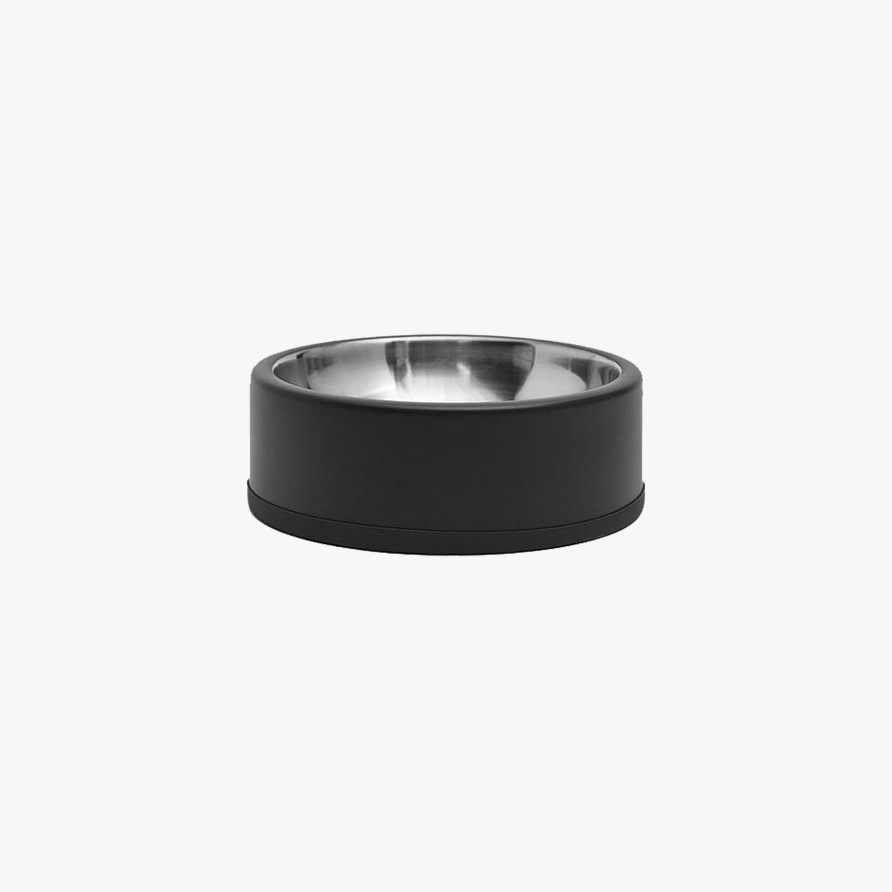 A circular dog food bowl with a matte black finish and stainless-steel inside